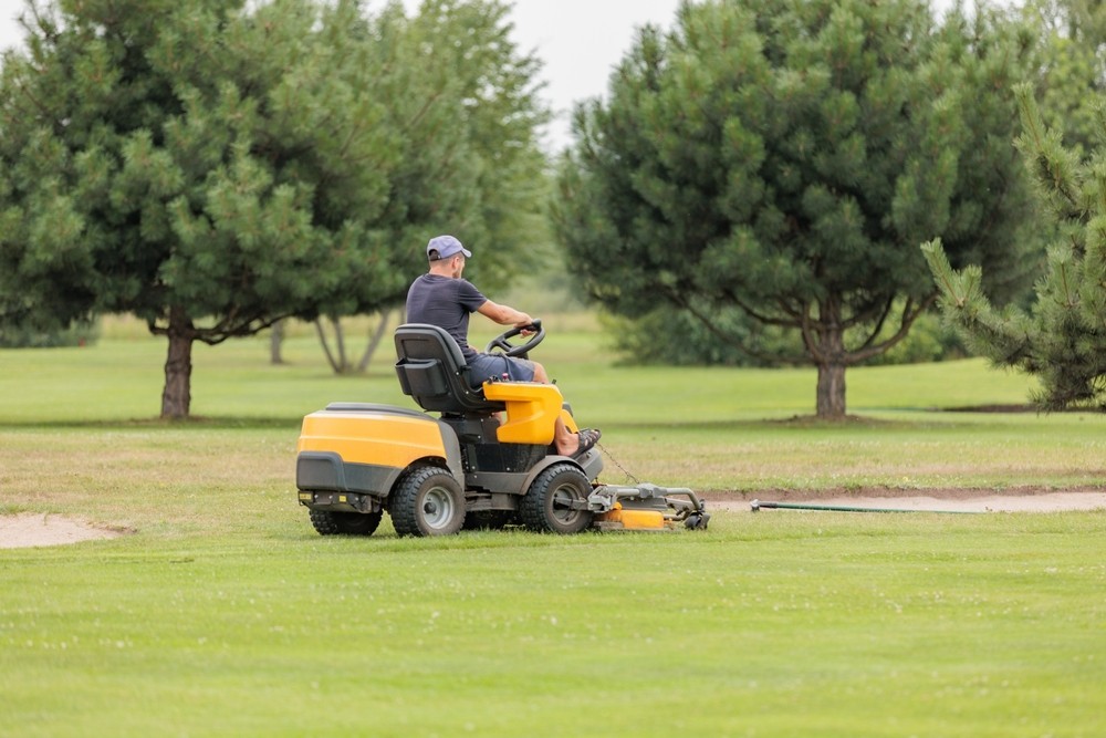 green mower on a golf course