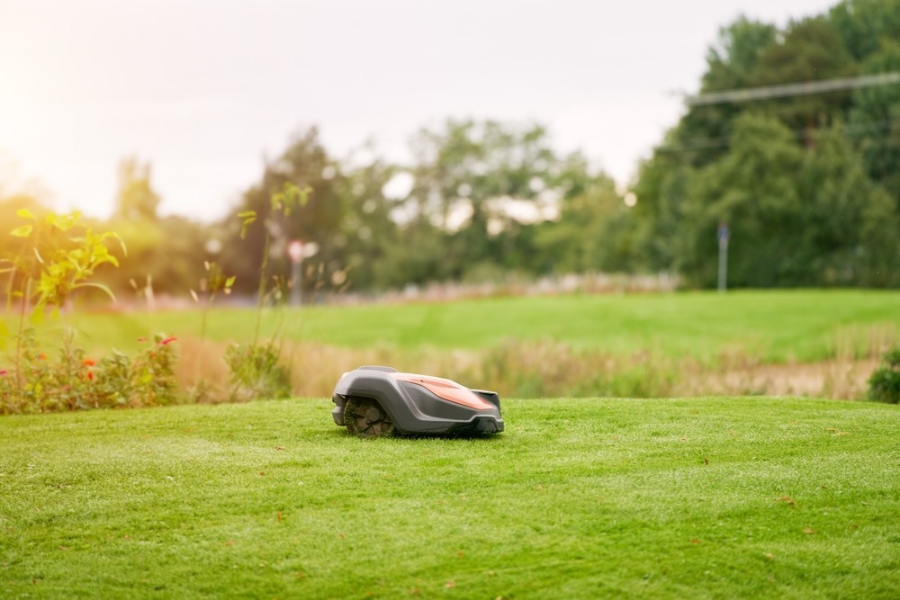 A robot lawnmower on a golf course