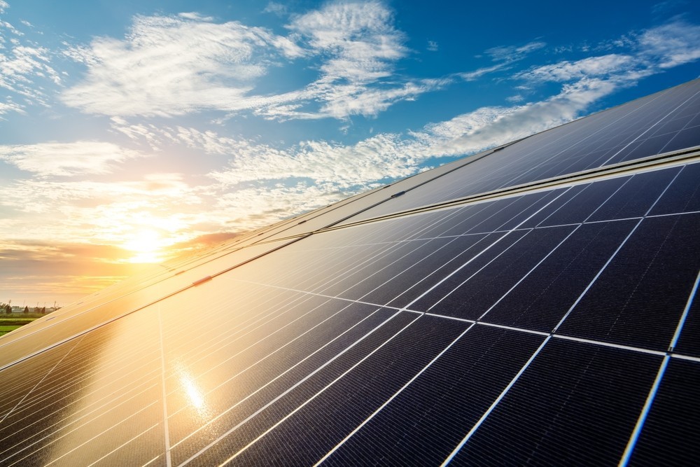 Solar panels with the sun reflecting off them