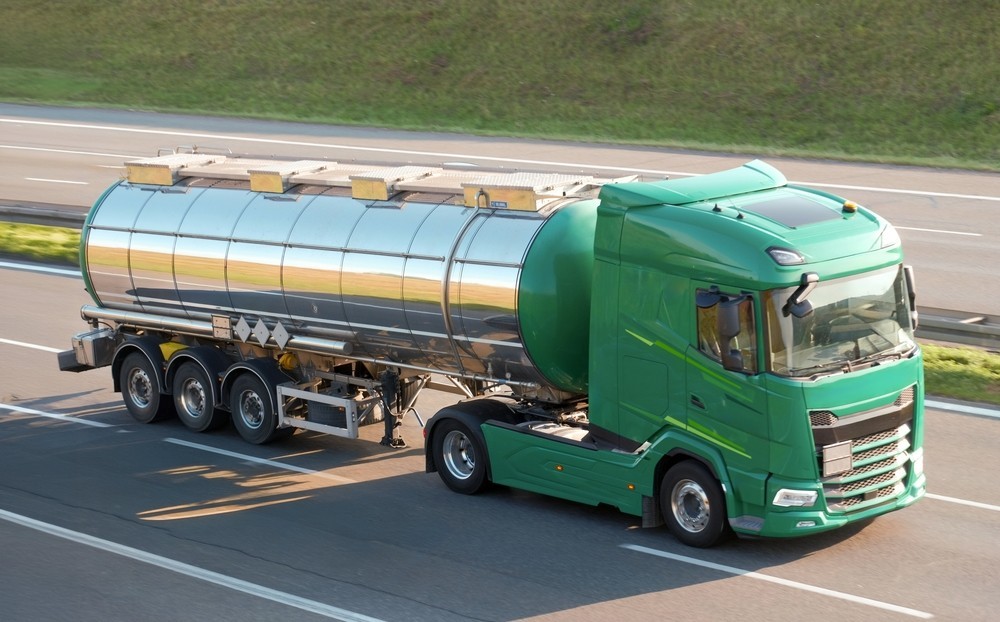 A tanker truck driving on the road
