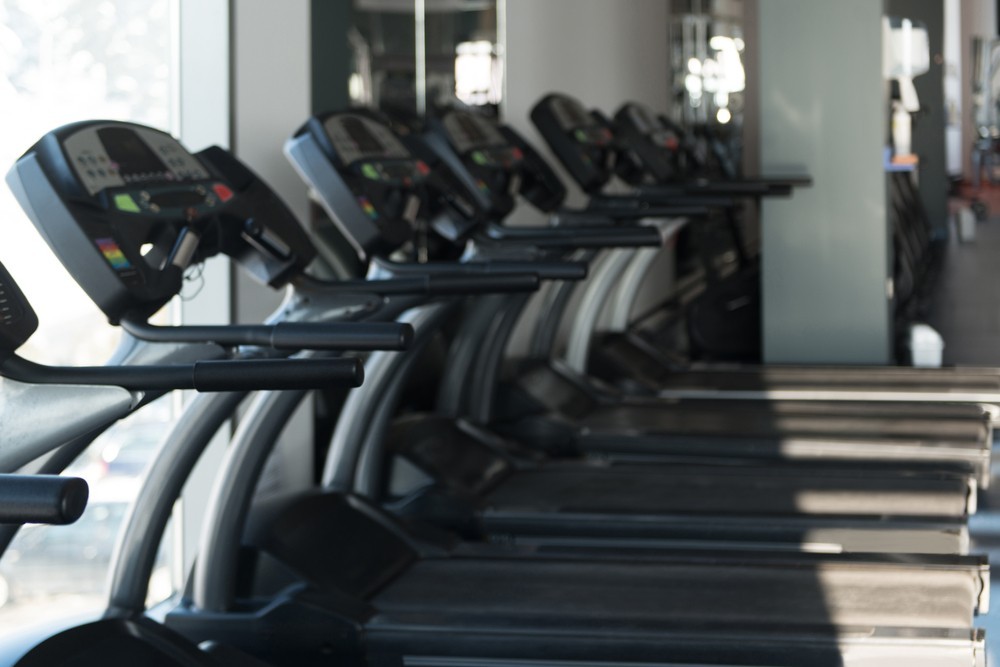 A row of treadmills in a gym