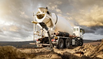 Concrete mixer with sunset background