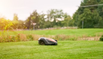 A robot lawnmower on a golf course