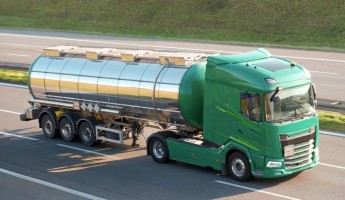 A tanker truck driving on the road