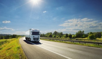 Image of a truck driving down the road