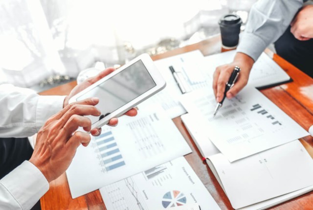Business team meeting Strategy Planning with new startup project plan Finance and Economy Graph with laptop successful teamwork