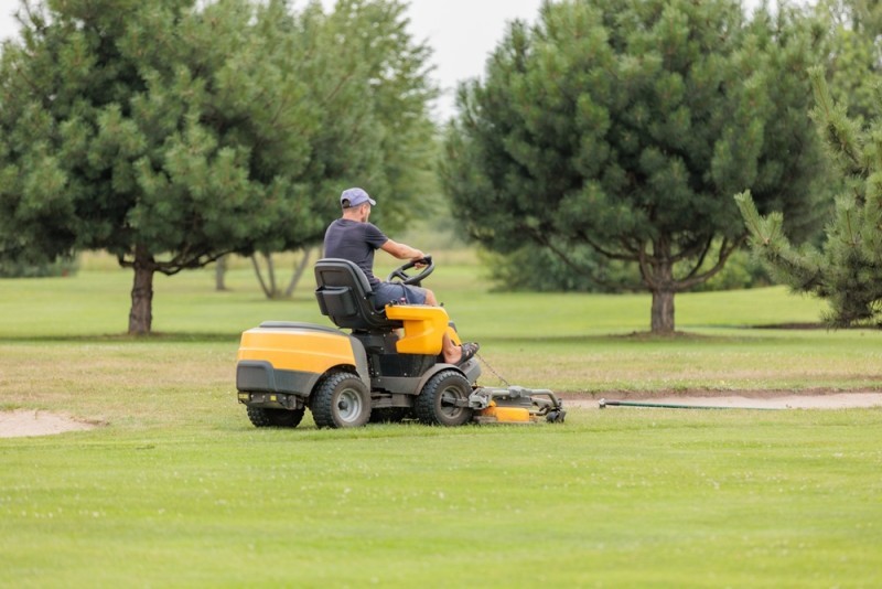 green mower on a golf course