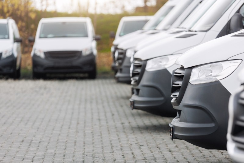 multiple minibuses in a car park