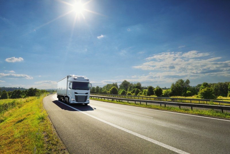 Image of a truck driving down the road